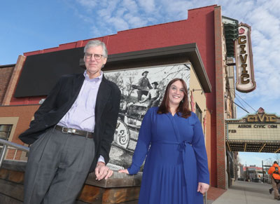 Chris Burnham and Rachel Bridenstine standing in front of the Akron Civic Theatre