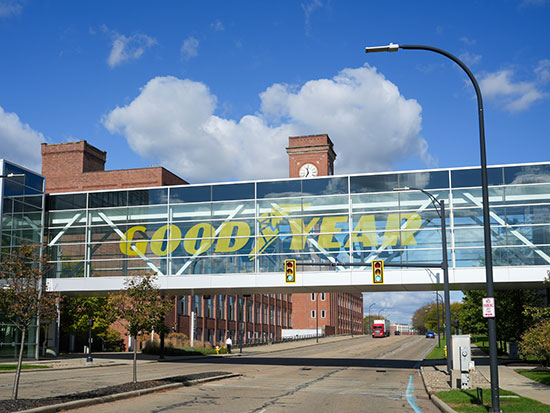 Bridge over a street with the Goodyear logo overtop